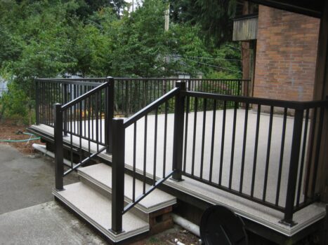 Picture of a deck with metal railings.